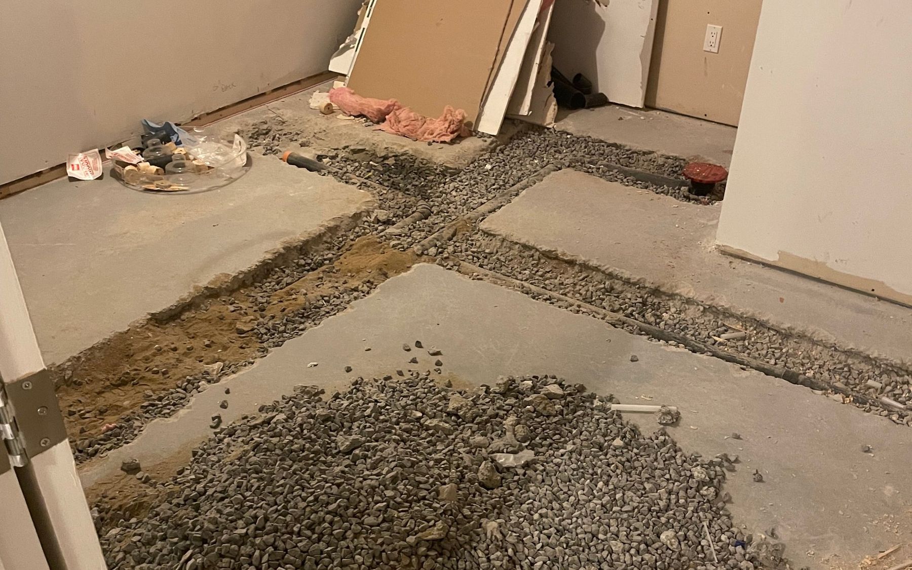 Concrete slab opened up to run new drain lines